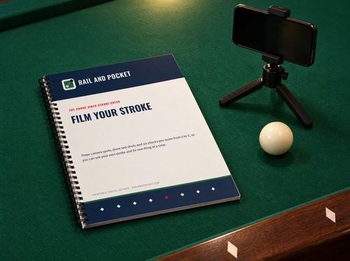 Film Your Stroke printed booklet on a pool table next to a phone on a small tripod